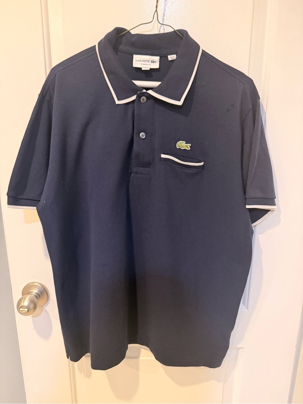 Lacoste Men's Navy Polo with White Trim and Chest Pocket